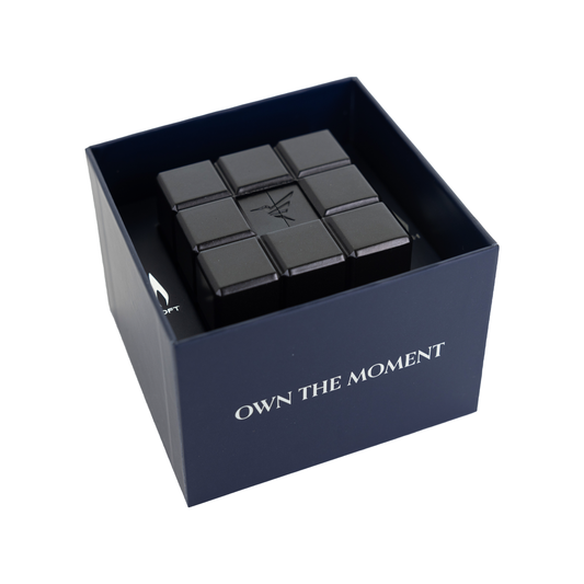 black Colibri Heritage Cube Desk Lighter in box with text "OWN THE MOMENT"